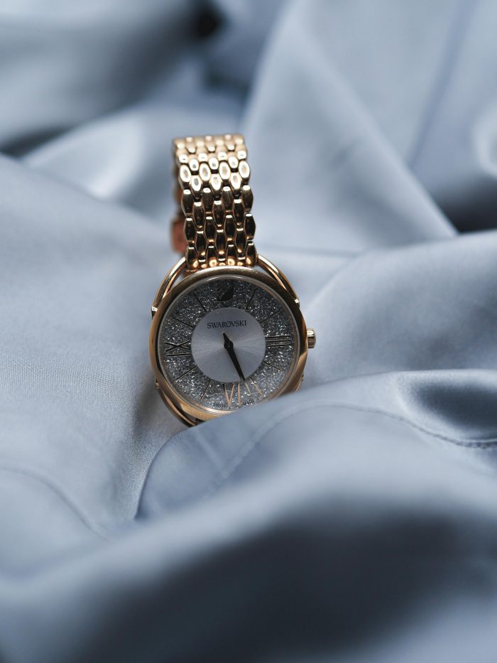 A gold Swarovski watch.