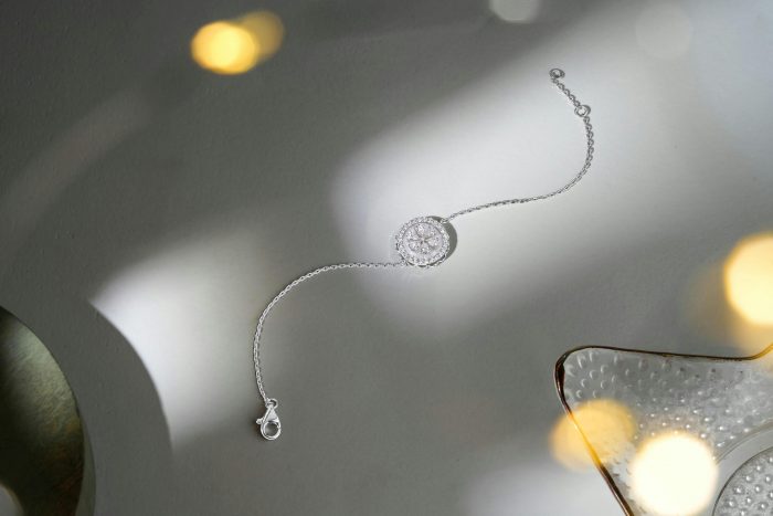 A piece of diamond jewellery laid on a table.