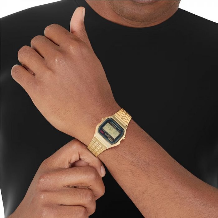 Man wearing the Casio gold A159 with a plain black T-shirt.