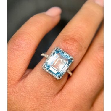 9ct Canadian White Gold Emerald Cut Blue Topaz with Diamond Halo Ring