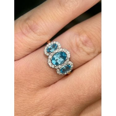 9ct Yellow Gold 3 Stone Oval Blue Topaz with Single Halo Diamond Ring