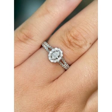 Platinum 0.45ct Total Oval Cut Centre with Single Halo & Split Diamond Shoulders Ring