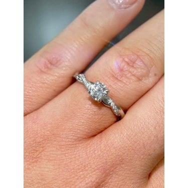 Platinum 0.50ct Round Brilliant Centre with Twist 0.15ct Diamond Shoulders Ring