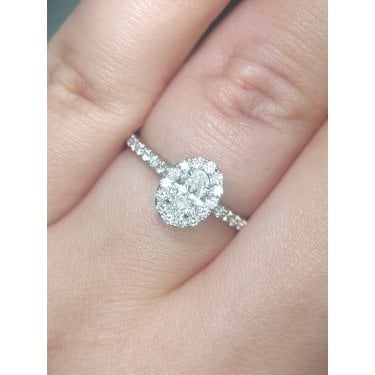 Platinum 0.64ct Total Oval Cut Centre with Single Halo & Diamond Shoulders Ring
