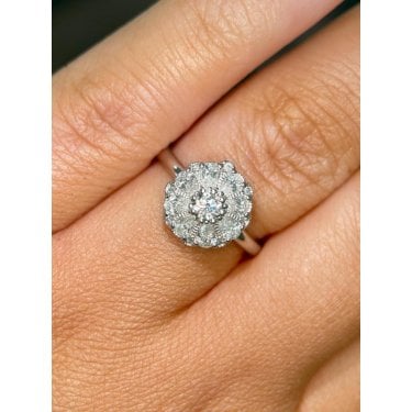 Platinum 0.68ct Total Round Brilliant Centre Stone with  Flower Style Pear Diamond Ring