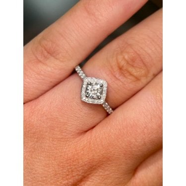 Platinum Total 0.70ct Round Brilliant Centre with Single Offset Halo & Diamond Shoulders Ring